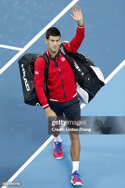 Novak Djokovic of Serbia celebrates winning his match against Zhang Ze of China during the Men's singles second round match on day six of the 2015...