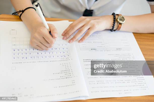 writing chinese language exame at hong kong school, asia - non western script stock pictures, royalty-free photos & images