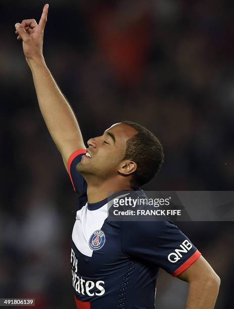Paris' Brazilian forward Lucas Moura celebrates scoring a goal during the French L1 football match Paris Saint-Germain vs Montpellier on May 17, 2014...