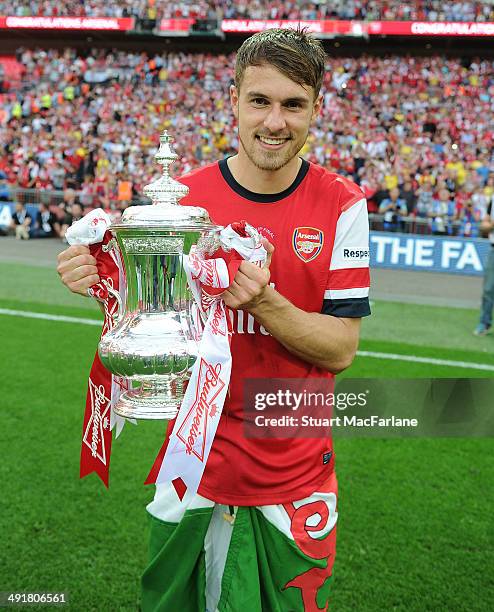 Arsenal's Aaron Ramsey with the FA Cup after the FA Cup Final between Arsenal and Hull City at Wembley Stadium on May 17, 2014 in London, England.