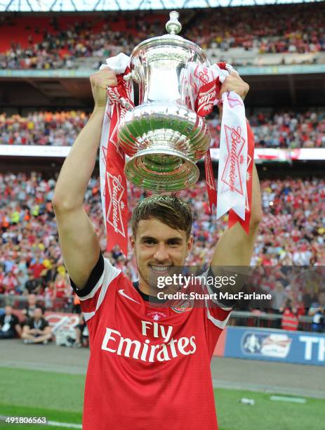 Arsenal's Aaron Ramsey with the FA Cup after the FA Cup Final between Arsenal and Hull City at Wembley Stadium on May 17, 2014 in London, England.