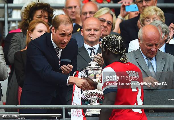President of the Football Association, Prince William, Duke of Cambridge shakes hands with Bacary Sagna of Arsenal after the FA Cup with Budweiser...