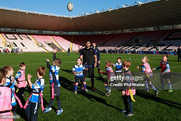 Liam Messam of the All Blacks assists with a skills session for young rugby players during a New Zealand All Blacks Community Event on October 8,...