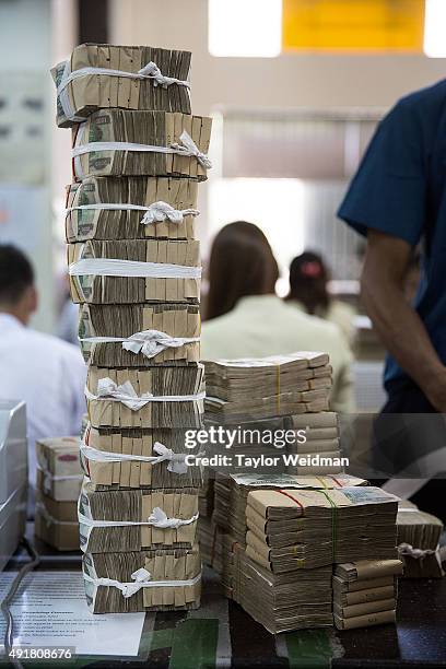 Notes are bundled after being deposited at the KBZ Bank main office on October 8, 2015 in Yangon, Burma. In Burma, the most widely deposited bank...