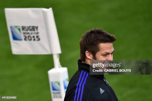 New Zealand's flanker and captain Richie McCaw smiles at the end of the captain's run training session at Saint James' Park Stadium in...