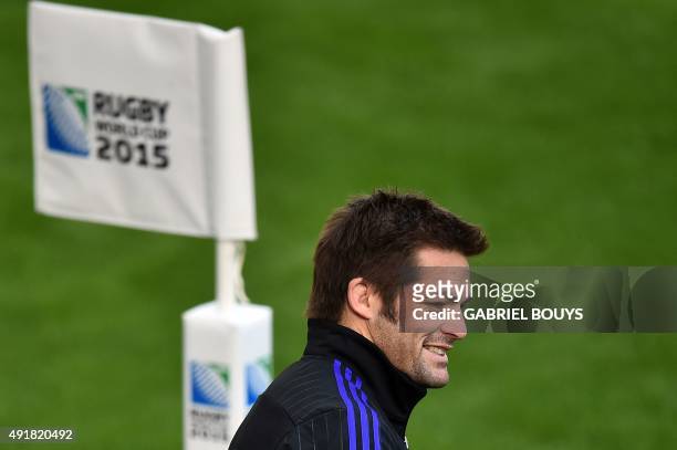 New Zealand's flanker and captain Richie McCaw smiles at the end of the captain's run training session at Saint James' Park Stadium in...