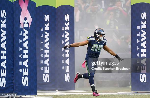 Wide receiver Doug Baldwin of the Seattle Seahawks runs on to the field during player introduction before a football game against the Detroit Lions...