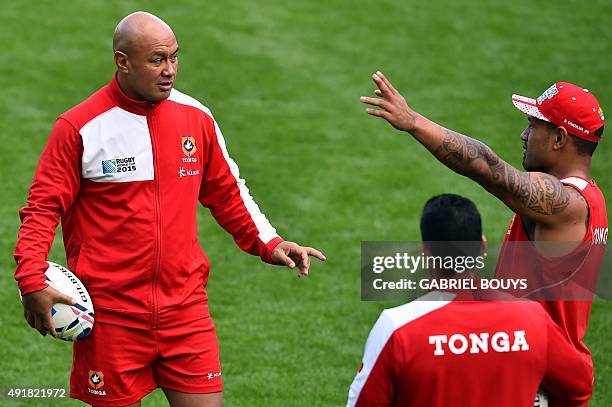 Tonga's flanker and captain Nili Latu speaks with Tonga's scrum half Sonatane Takulua during a captain's run training session at Saint James' Park...