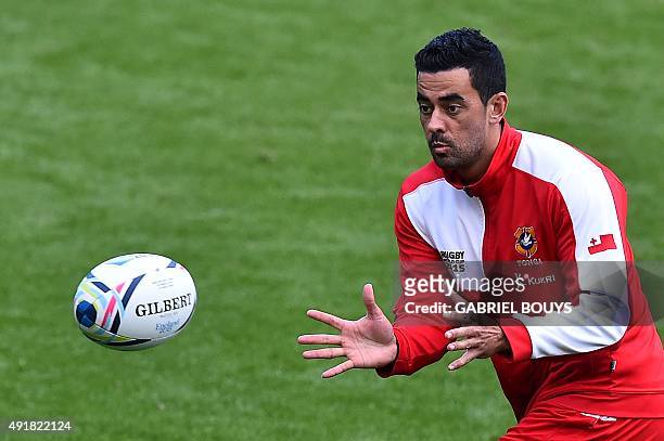 Tonga's fly half Kurt Morath catches the ball during a captain's run training session at Saint James' Park stadium in Newcastle-upon-Tyne, northeast...