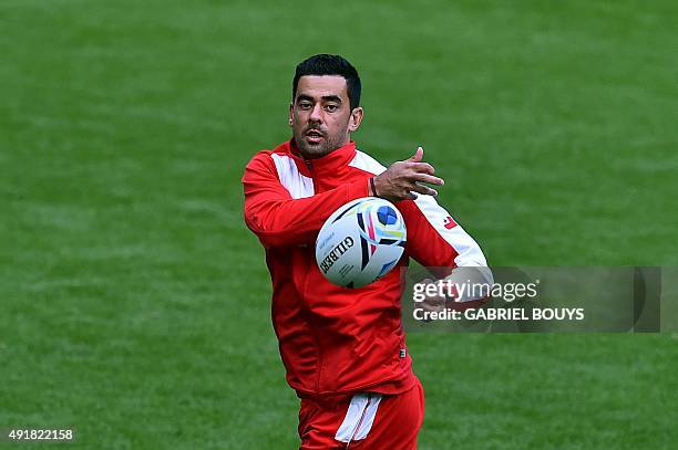 Tonga's fly half Kurt Morath passes the ball during a captain's run training session at Saint James' Park stadium in Newcastle-upon-Tyne, northeast...