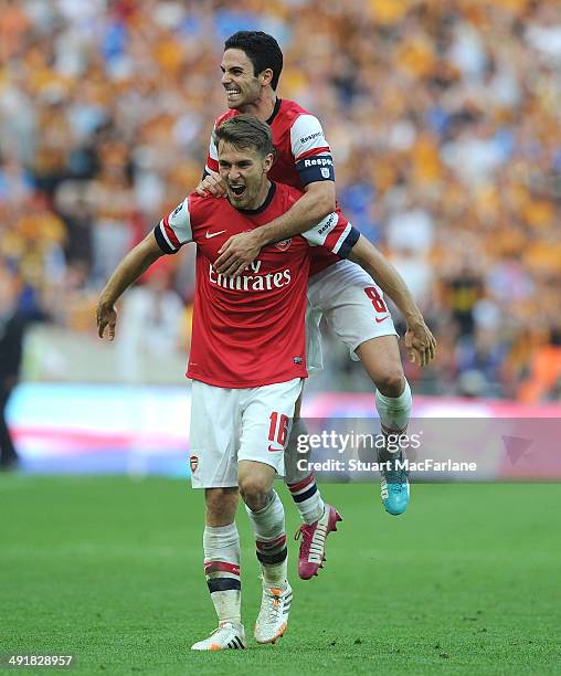 Aaron Ramsey and Mikel Arteta celebrate at the final whistle after the FA Cup Final between Arsenal and Hull City at Wembley Stadium on May 17, 2014...