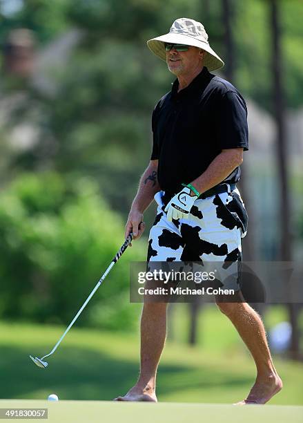 Celebrity golfer Jim McMahon strokes a putt on the third green during the third round of the BMW Charity Pro-Am Presented by SYNNEX Corporation held...