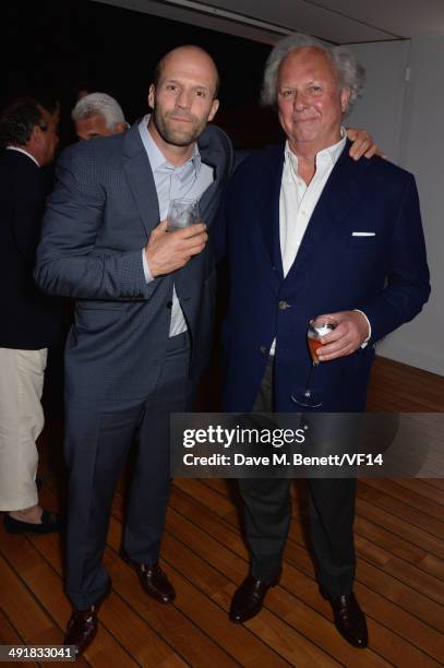 Jason Statham and Graydon Carter attend the Vanity Fair And Armani Party at the 67th Annual Cannes Film Festival on May 17, 2014 in Cap d'Antibes,...