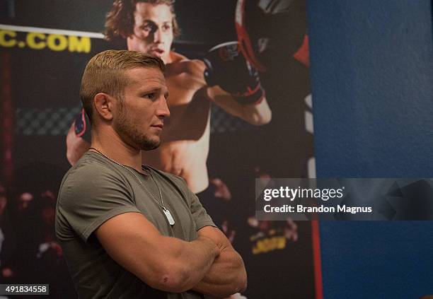 Bantamweight champion TJ Dillashaw watches as Billy Quarantillo warms up before facing Saul Rogers during the filming of The Ultimate Fighter: Team...