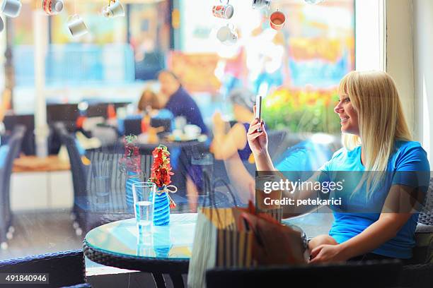 beautiful young blonde woman selfie in the cafe - knez mihailova street stock pictures, royalty-free photos & images