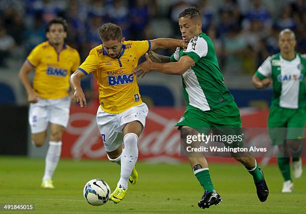 Everton Ribeiro of Cruzeiro struggles for the ball with Souza of Coritiba during a match between Cruzeiro and Coritiba as part of Brasileirao Series...
