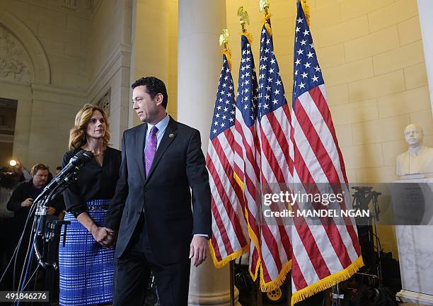 Rep. Jason Chaffetz, R-UT, with wife Julie at his side, arrives to speak to the media following the Republican nomination election for House speaker...