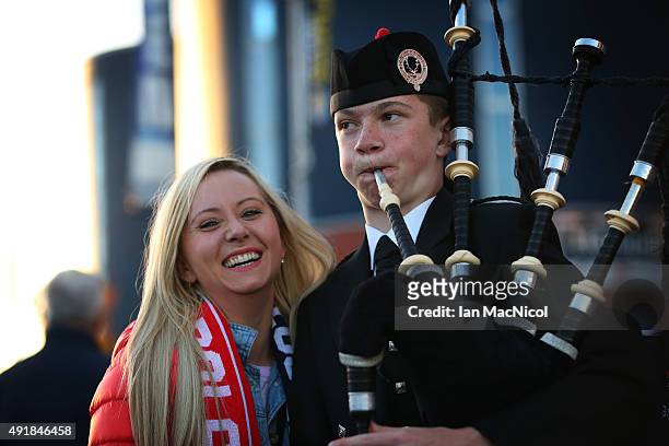 Polish fan poses with a piper ahead of the UEFA EURO 2016 qualifier between Scotland and Poland at Hampden Park on October 08, 2015 in Glasgow,...