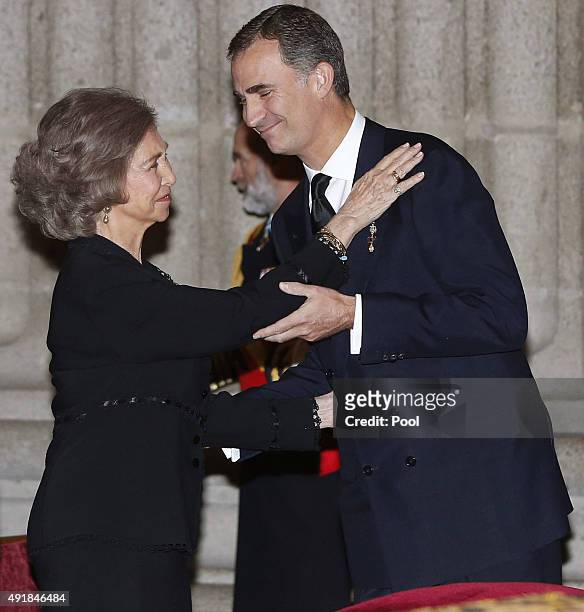 King Felipe VI of Spain greets his mother Queen Sofia of Spain as they arrive at El Escorial Monastery for a Corpore Insepulto Mass of Spain's Duke...