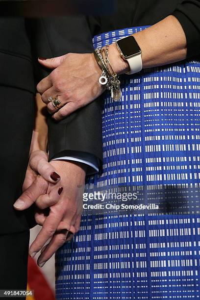House Oversight and Government Reform Committee Chairman Jason Chaffetz holds hands with his wife Julie Chaffetz as he confirms that he will continue...