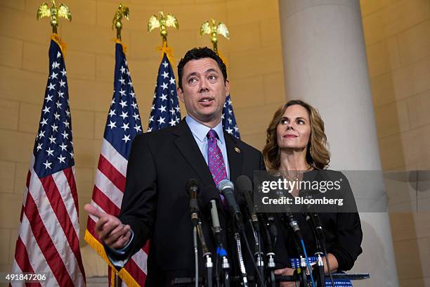 Representative Jason Chaffetz, a Republican from Utah, left, stands with wife Julie Chaffetz while speaking to the media after House Majority Leader...