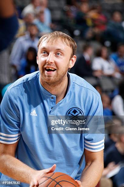 Oleksiy Pecherov of the Denver Nuggets warms up before a preseason game against the Dallas Mavericks on October 6, 2015 at the American Airlines...