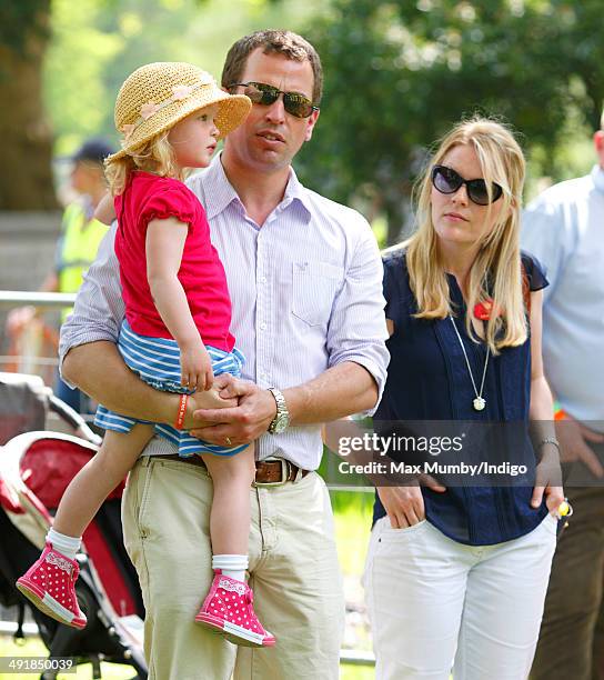 Peter Phillips, wife Autumn Phillips and daughter Savannah Phillips watch the International Carriage Driving Grand Prix event during day 4 of the...