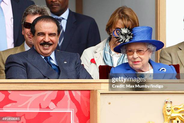 Hamad bin Isa Al-Khalifa, King of Bahrain and Queen Elizabeth II watch the Services Team Jumping Event from the Royal Box on day 4 of the Royal...