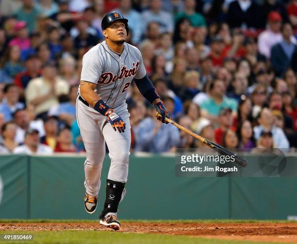 Miguel Cabrera of the Detroit Tigers watches the flight of his home run against the Boston Red Sox in the third inning at Fenway Park on May 17, 2014...