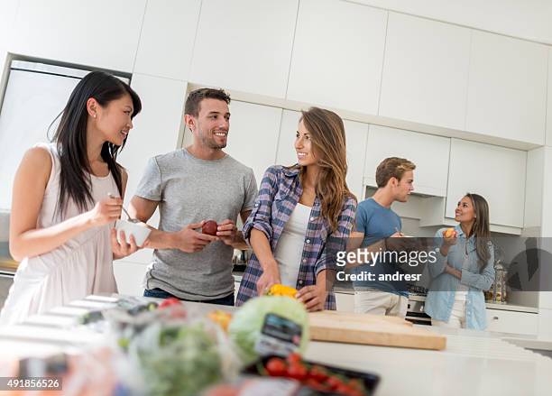 friends living together and cooking at home - college dorm party stock pictures, royalty-free photos & images