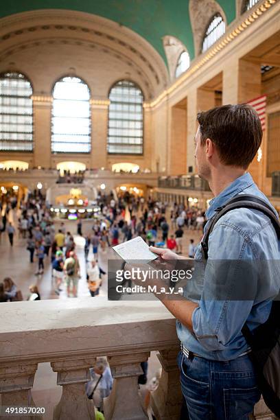man traveling - grand central tours stock pictures, royalty-free photos & images