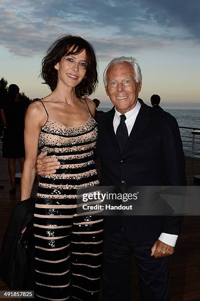 Sophie Marceau and Giorgio Armani attend the Vanity Fair And Armani Party at the 67th Annual Cannes Film Festival on May 17, 2014 in Cap d'Antibes,...