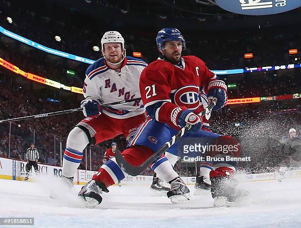 Derek Dorsett of the New York Rangers skates against Brian Gionta of the Montreal Canadiens in Game One of the Eastern Conference Final during the...