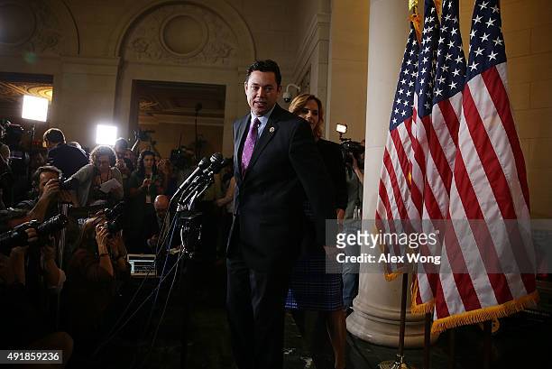 Rep. Jason Chaffetz and his wife Julie approach the podium to speak to members of the media after a closed House Republican election meeting to pick...
