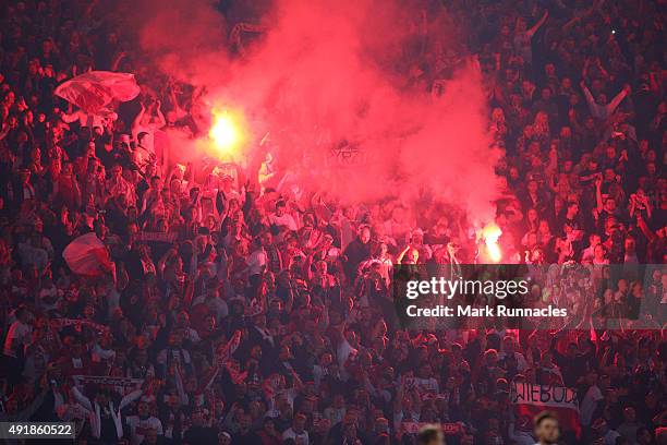 Poland fans let off flairs from the crowd during the EURO 2016 Qualifier between Scotland and Poland at Hamden Park on October 8, 2015 in Glasgow,...