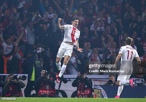 Robert Lewandowski of Poland celebrates scoring a goal early in the first half during the EURO 2016 Qualifier between Scotland and Poland at Hamden...