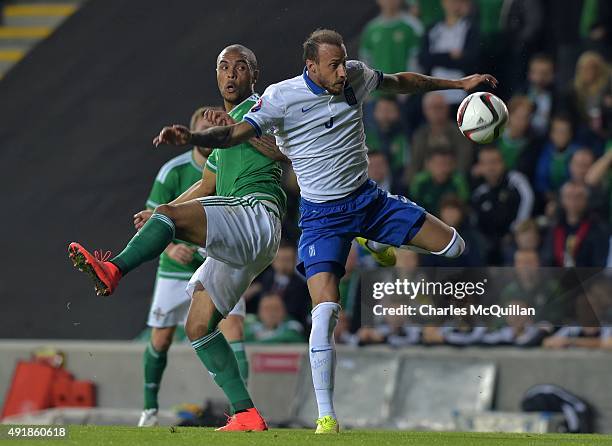 Josh Magennis of Northern Ireland and Vangelis Moras of Greece during the Euro 2016 Group F international football match at Windsor Park on October...