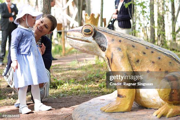 Princess Estelle of Sweden and Crown Princess Victoria of Sweden open a Fairytale Path at Lake Takern on May 17, 2014 in Mjolby, Sweden.