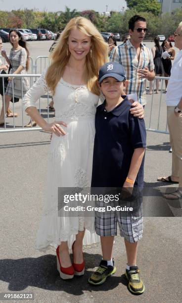 Actress Charlotte Ross and son Maxwell Ross Goldman arrive at the Ovarian Cancer Research Fund's Inaugural Super Saturday LA event at Barker Hangar...
