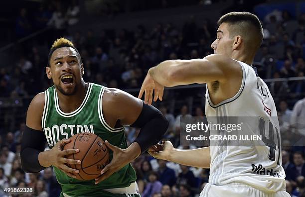 Boston Celtics' forward Jared Sullinger vies with Real Madrid's Swedish forward Jeffery Taylor during their NBA Global Games Madrid 2015 basketball...