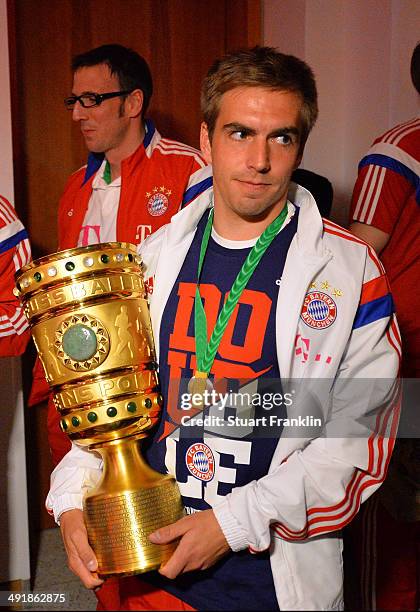 Philipp Lahm brings in the trophy during the FC Bayern Muenchen Champions party after winning the German DFB Cup finale at Deutsche Telekom...