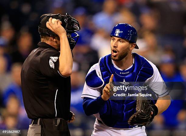 Brett Hayes of the Kansas City Royals argues a call with home plate umpire Chris Sega during the 9th inning of the game at Kauffman Stadium on May...