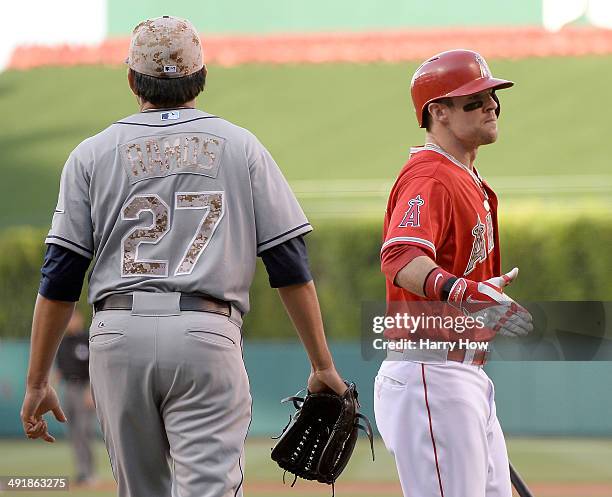 Collin Cowgill of the Los Angeles Angels reacts to his run for a 1-0 lead in front of pitcher Cesar Ramos of the Tampa Bay Rays during the first...