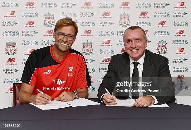 New Manager of Liverpool Jurgen Klopp signs his new contract to manage Liverpool with Ian Ayre chief executive officer of Liverpool Football on...