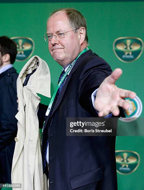 Peer Steinbrueck gestures on the green carpet prior to the DFB Cup final at Olympiastadion on May 17, 2014 in Berlin, Germany.