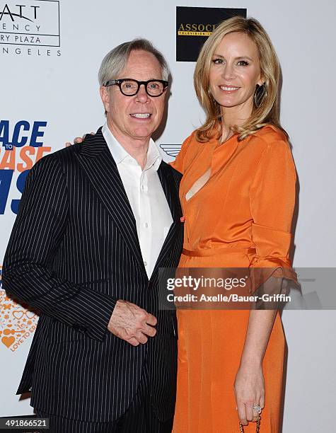 Fashion designer Tommy Hilfiger and Dee Ocleppo arrive at the 21st Annual Race To Erase MS Gala at the Hyatt Regency Century Plaza on May 2, 2014 in...