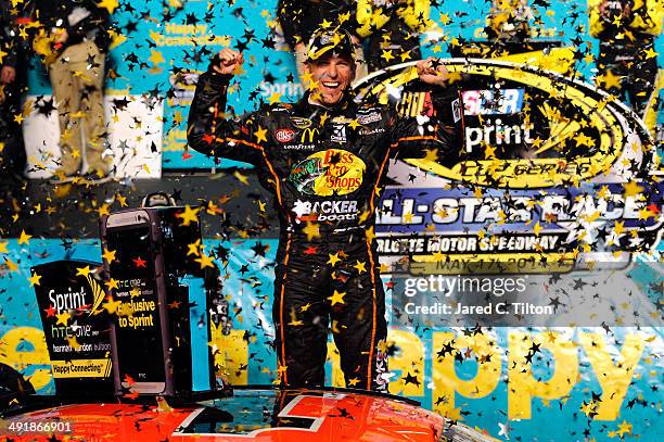 Jamie McMurray, driver of the Bass Pro Chevrolet, celebrates in victory lane after winning the NASCAR Sprint Cup Series Sprint All-Star Race at...