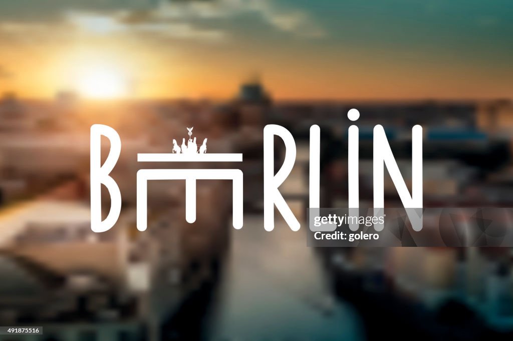 Typographic berlin sign on blurred sunset skyline