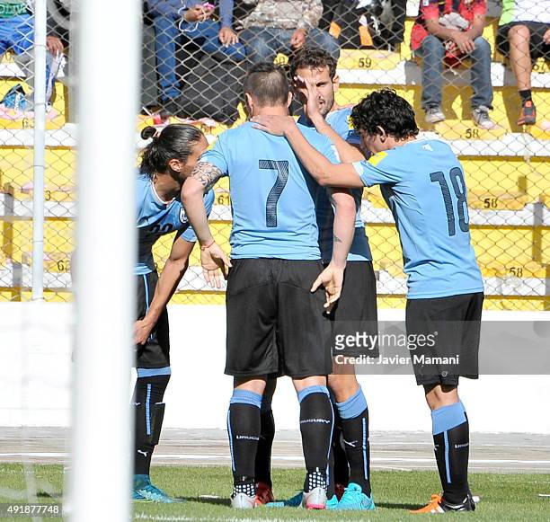 Martin Caceres of Uruguay celebrates with teammates after scoring the opening goal during a match between Bolivia and Uruguay as part of FIFA 2018...