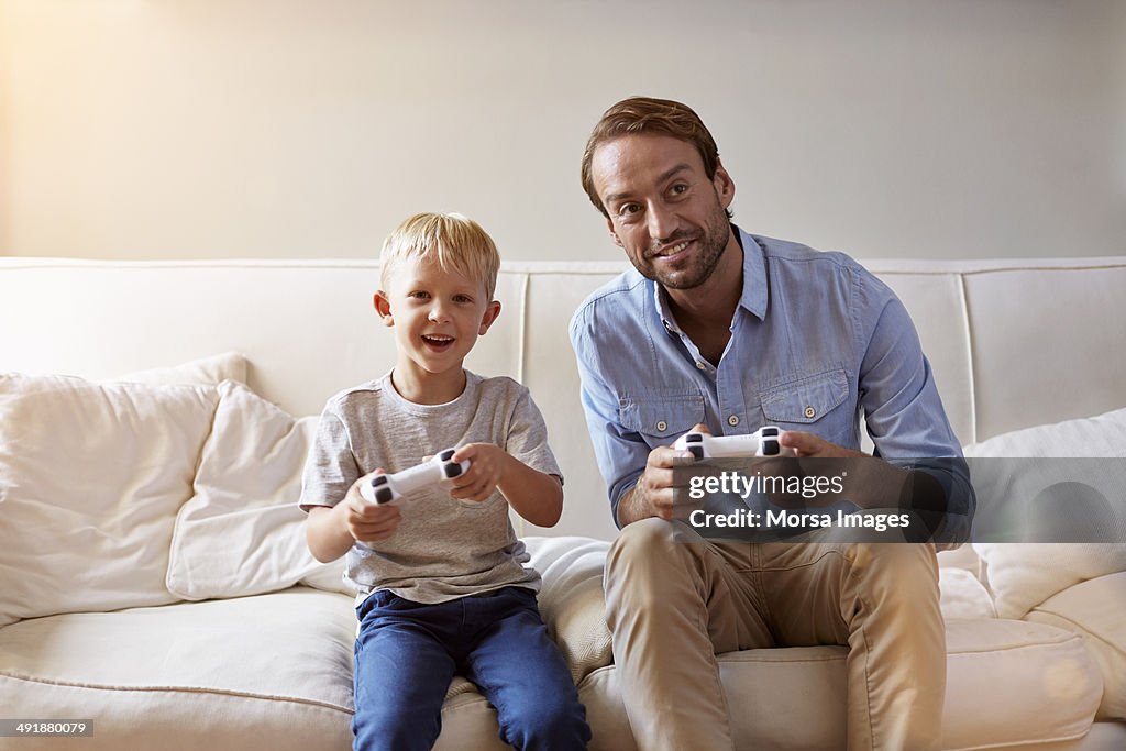 Father and son playing video games
